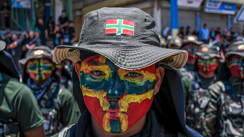 tribal student painted with the flag of the Zomi tribe takes part in the silent march in memory of all the tribal poeple who lost their lives in the ethnic clashes in Manipur