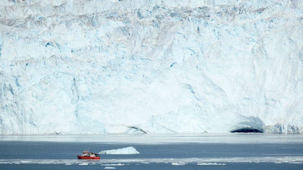 A boat by the coast of Greenland