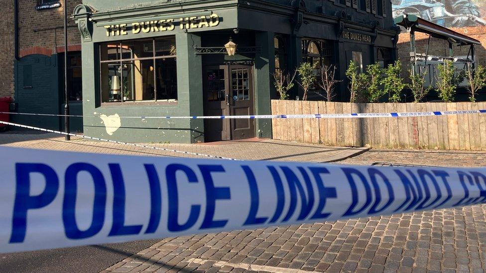 Photo of police tape outside The Duke pub