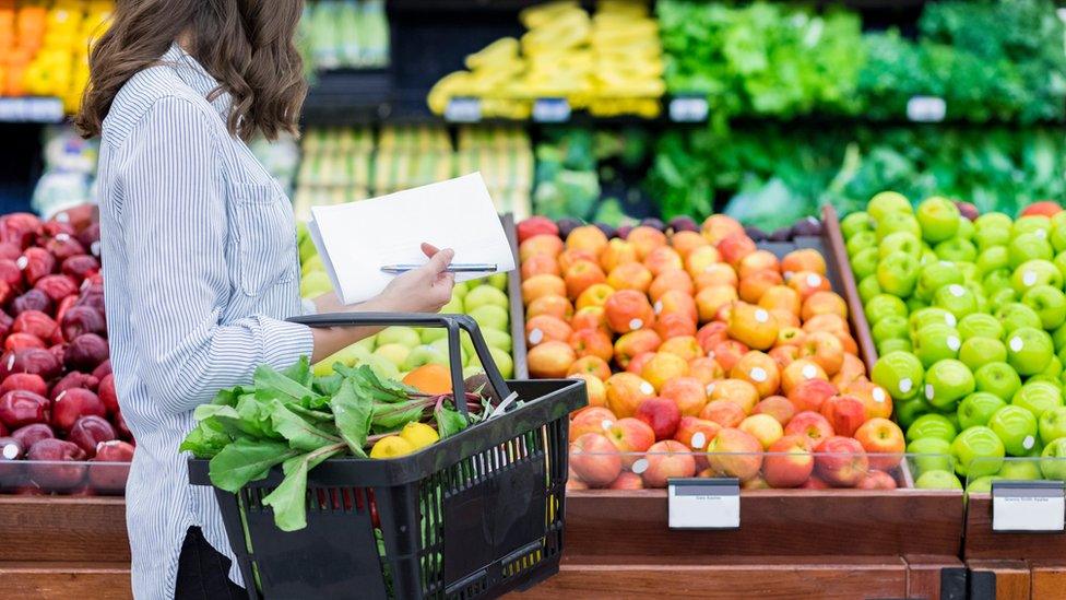 Woman buying fruit and vegetables