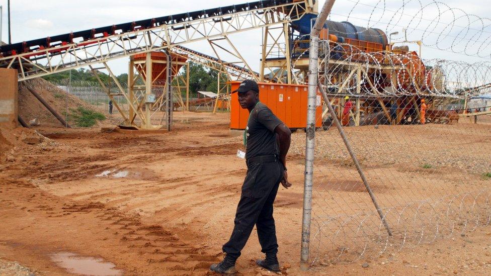 A file photo from 2011 shows a private security employee guarding a diamond processing plant in the diamond-rich eastern Marange region of Zimbabwe