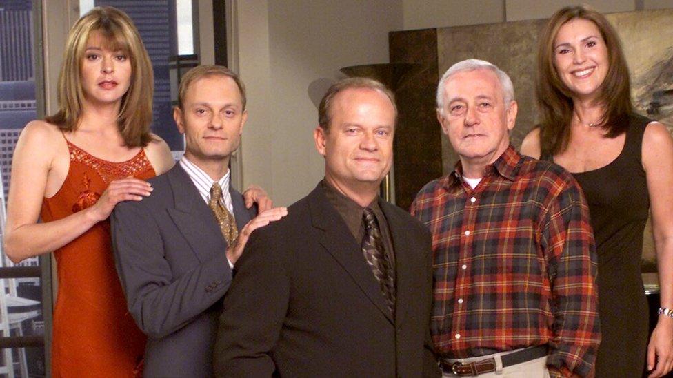 The cast of Frasier, from left to right: Jane Leeves As Daphne Moon, David Hyde Pierce As Dr. Niles Crane, Kelsey Grammer As Dr. Frasier Crane, John Mahoney As Martin Crane, And Peri Gilpin As Roz Doyle