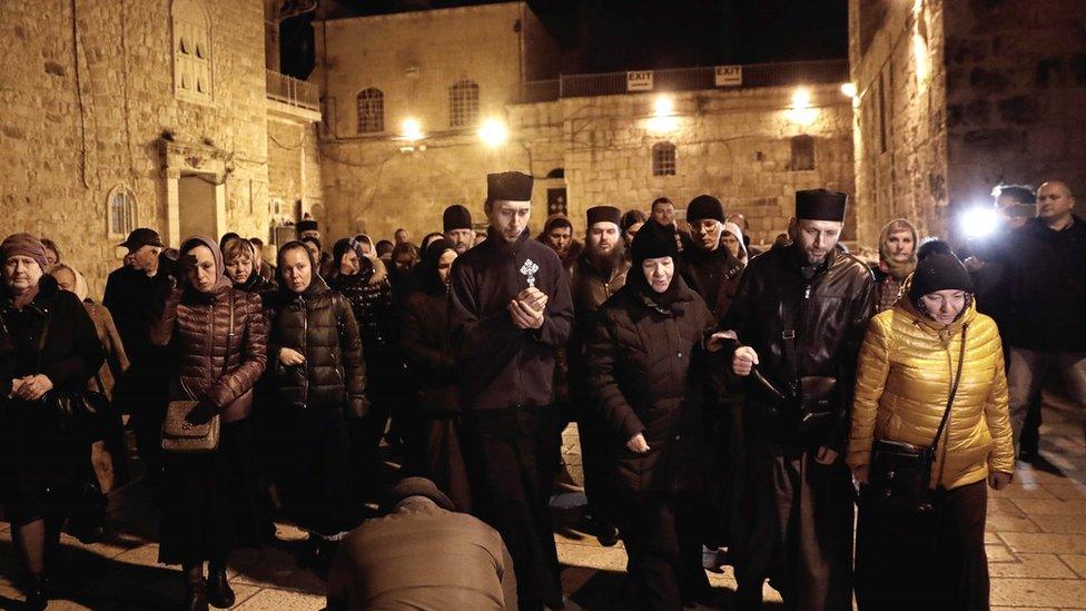 people outside the church of the holy sepulchre