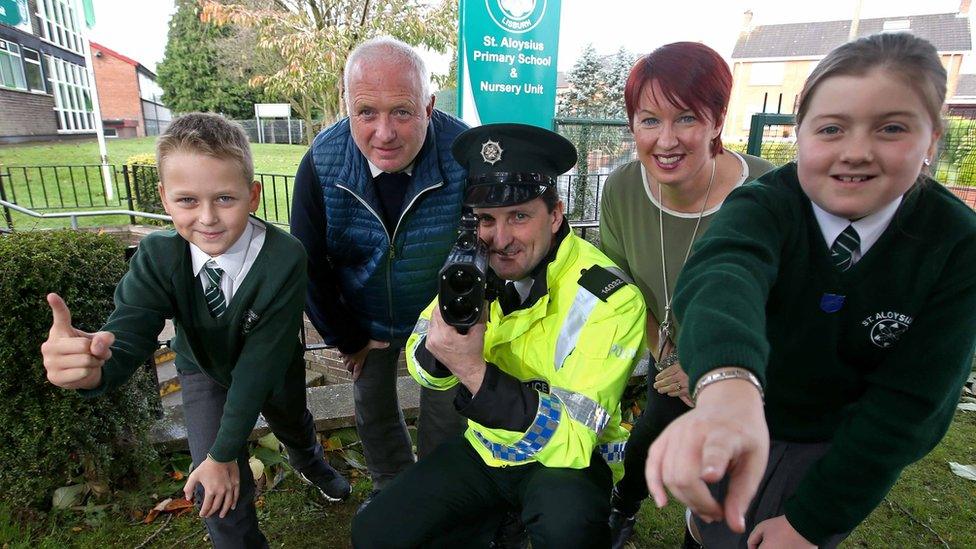 PC Jacky McDowell (centre) with pupils and staff from St Aloysius Primary School