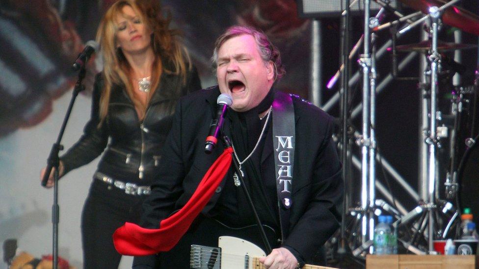 The singer performing at Newbury Racecourse, Newbury in 2013