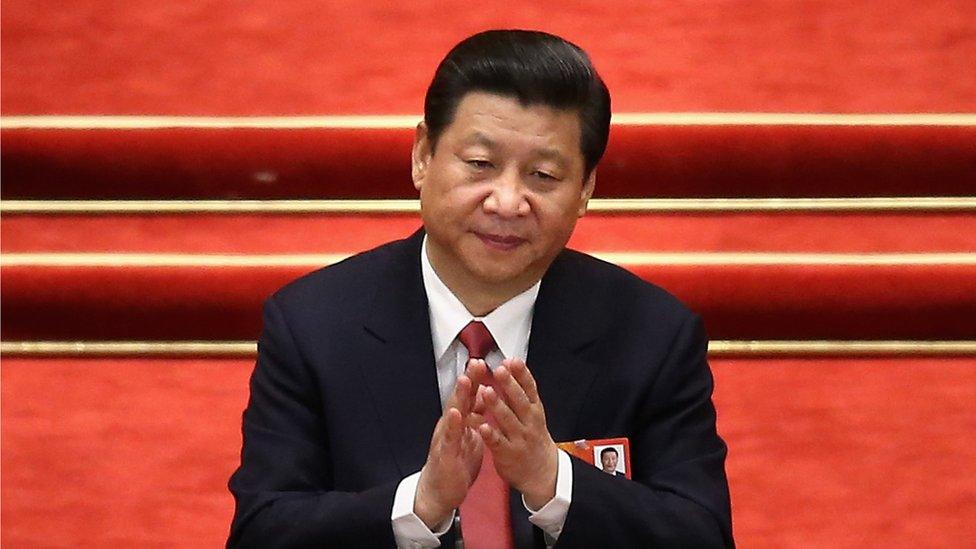 President Xi Jinping applauds at the the fourth plenary meeting of the National People's Congress on 14 March 2013