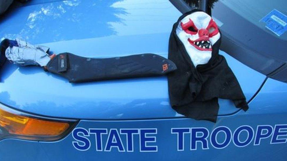 A handout picture from Maine State Police shows a clown mask and the machete which had been taped to the stump of Corey Berry's arm