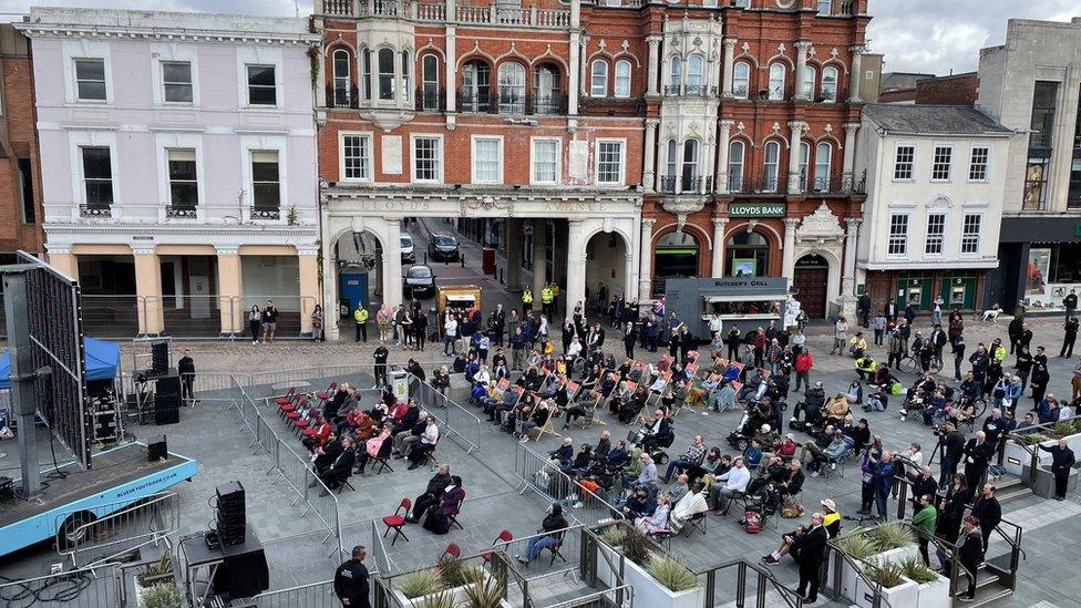 People watching funeral in Cornhill