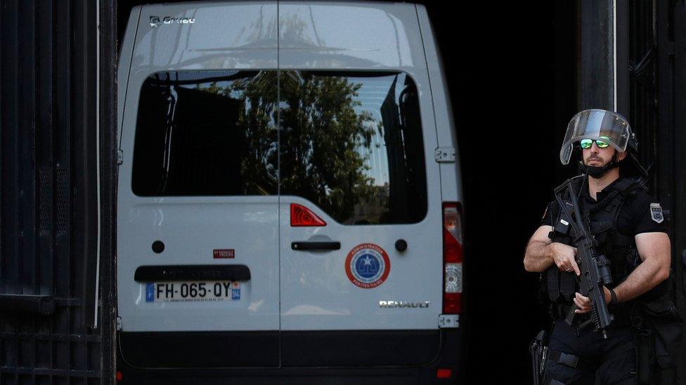 A police convoy believed to be carrying Rwandan genocide fugitive Felicien Kabuga arrives at the Paris courthouse