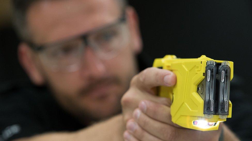 A taser being demonstrated