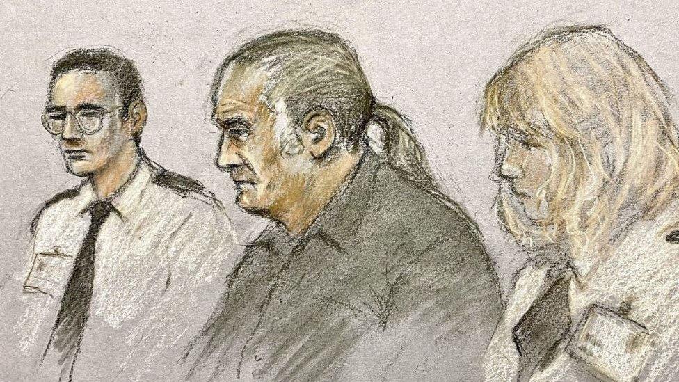 Court sketch of Steven Craig with a guard on either side