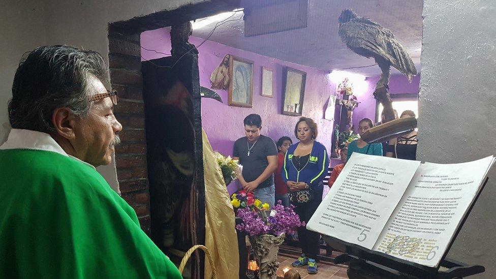 Mr Santana officiates at the temple to Santa Muerte in Guadalajara