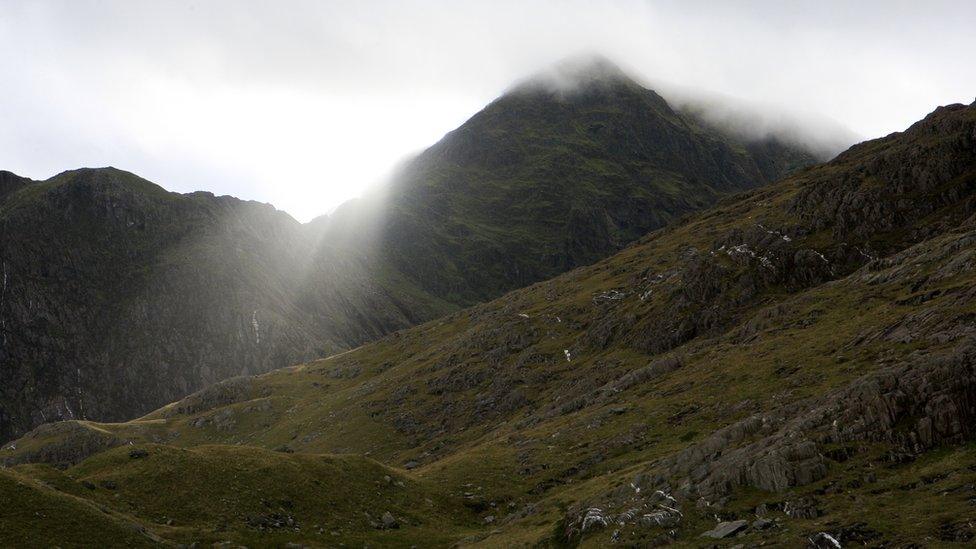 Snowdon under cloud as the sun tries to push through