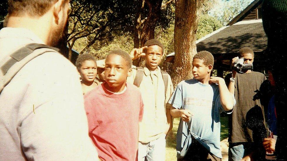 Devon Brown in the red shirt with a counsellor and other Baraka students