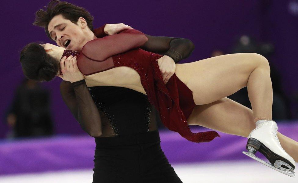 Gold medallists Tessa Virtue and Scott Moir of Canada holding each other tightly on the ice