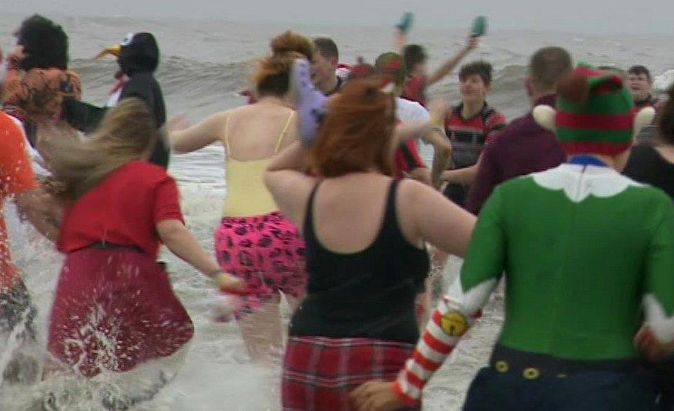 People braving the sea