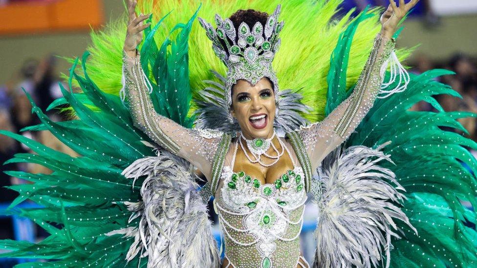 A member of Imperio Serrano Samba School gestures during their 2019 parade