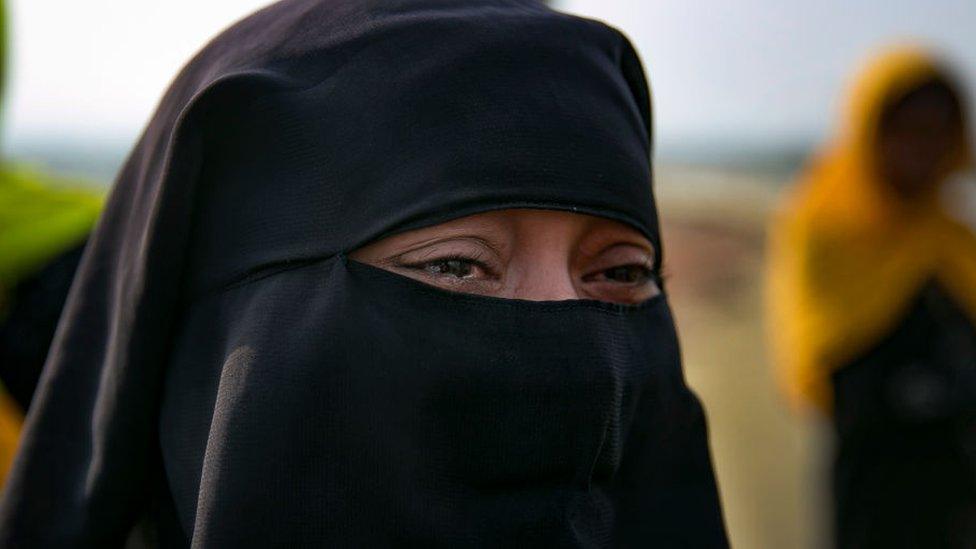 A Rohingya woman cries as she crosses into mainland Bangladesh from Shah Porir Dwip November 24, 2017 in Cox's Bazar, Bangladesh.