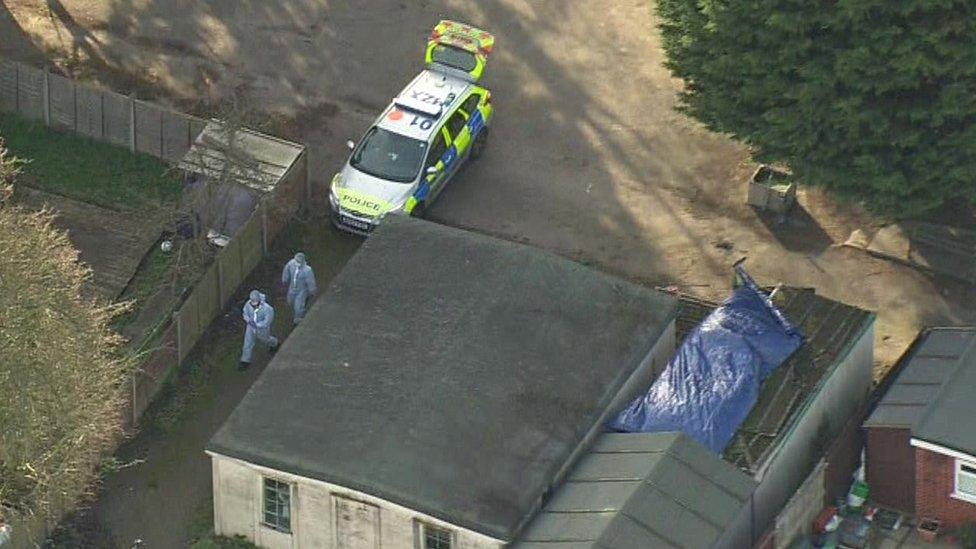 Forensic officers at the allotment