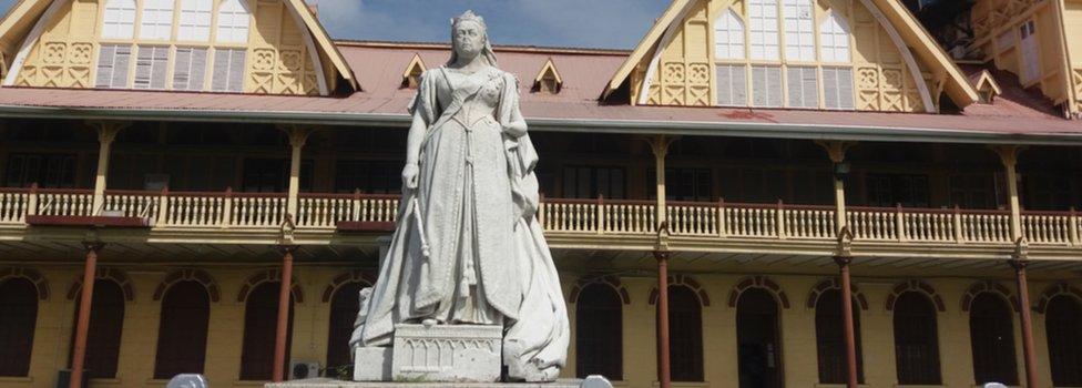 A view of the statue of Queen Victoria in front of the Supreme Court in Georgetown