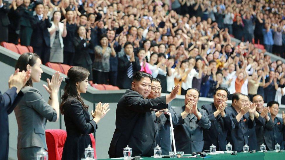 Kim Jong-un (centre) waves to crowds at the opening day of the Mass Games in Pyongyang, North Korea