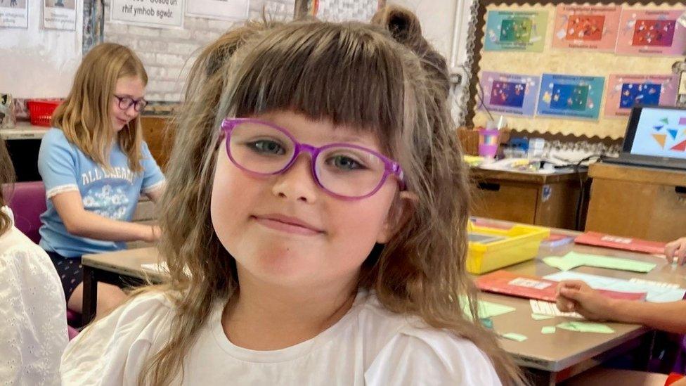 Sofiia smiling in a classroom