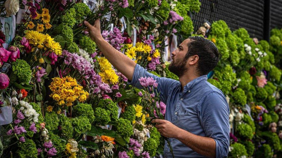 Flowers for some of those killed in the Miami apartment block collapse, June 2021