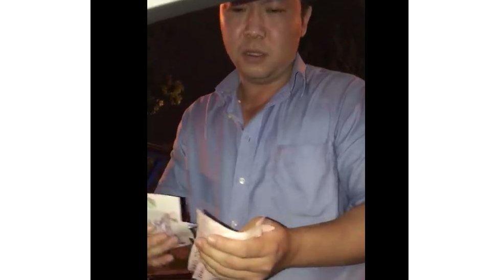 Gary Lim counting bills