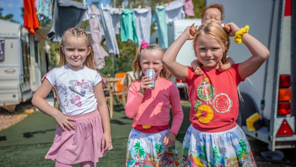 Three children who live on the site