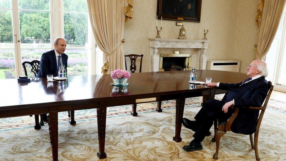 Ireland's new Taoiseach (Prime Minister) Micheal Martin (L) attending a meeting with Irish President Michael D. Higgins