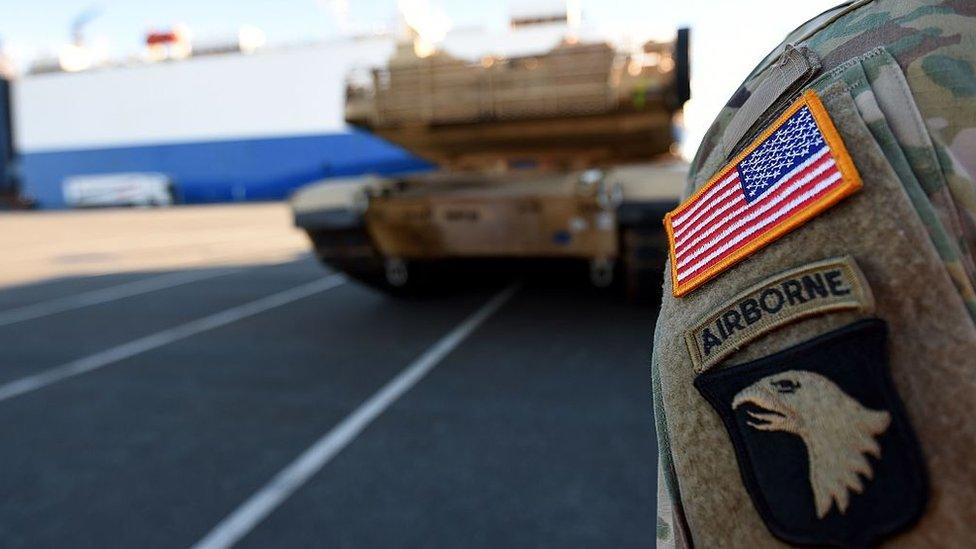 US military vehicles are unloaded from a transport ship in the harbour in Bremerhaven, north-western Germany, on January 6, 2017