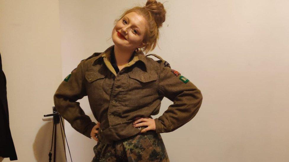 Amber wearing her grandfather's military clothes