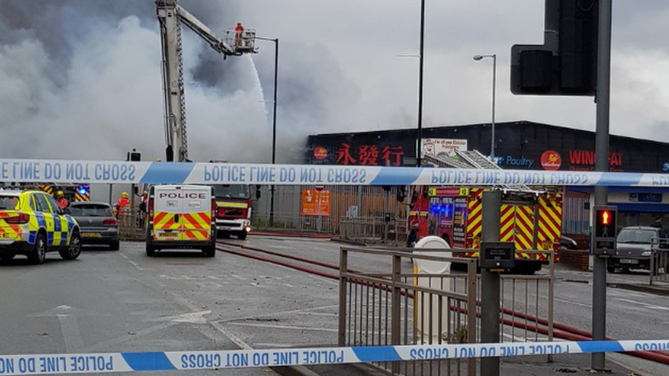 Police cordoned off the area of the cash and carry