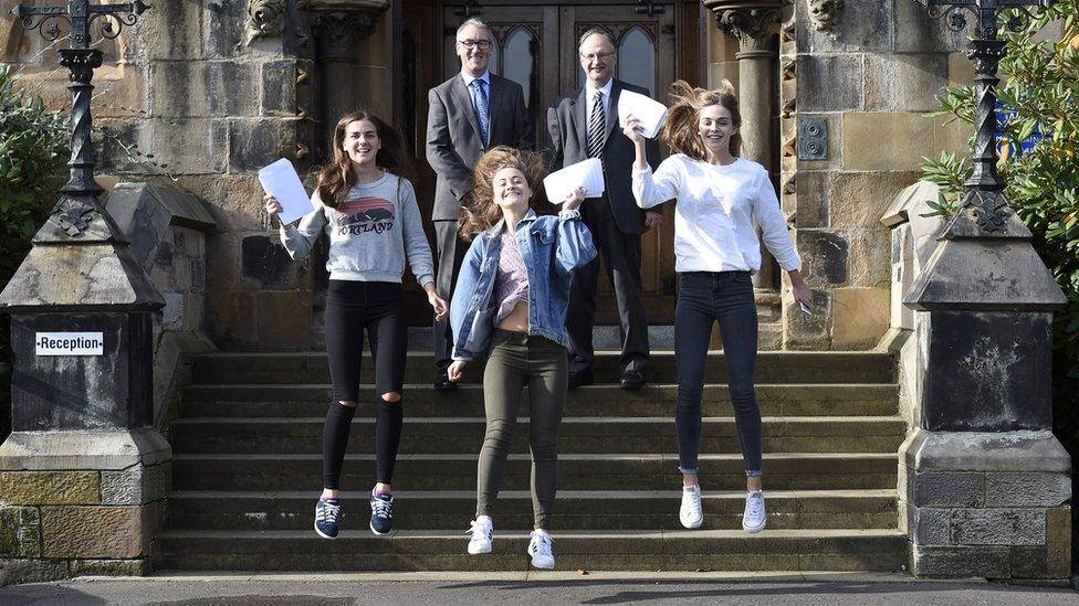 The education minister also visited Methodist College in Belfast where pupils Lauren Bell, Zoe Hagan and Caitriona Marsh were jumping for joy over their results