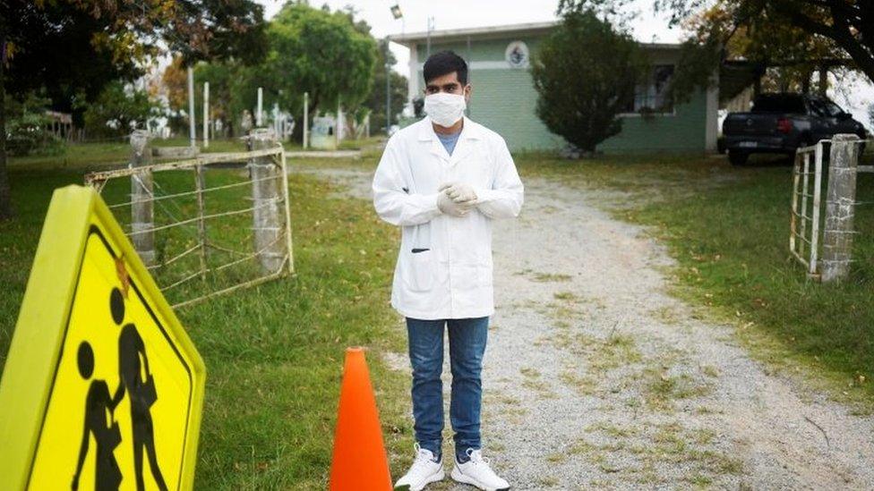 Teacher Sergio Ferraro waits in the morning for students at Escuela 30, a rural school that has resumed classes after a month off due to the coronavirus disease (COVID-19), in San Jose, Uruguay April 22, 2020