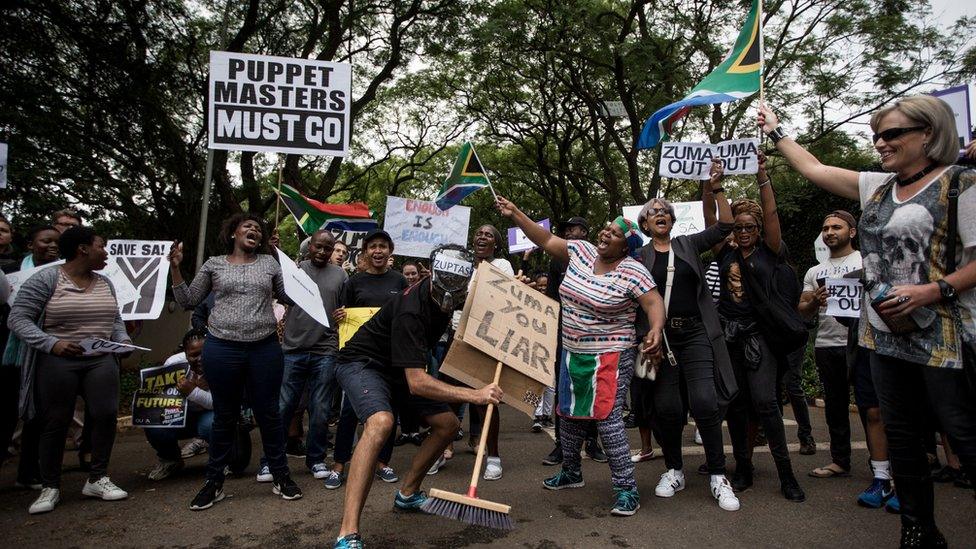 A protest outside the Gupta family compound in Johannesburg earlier this year