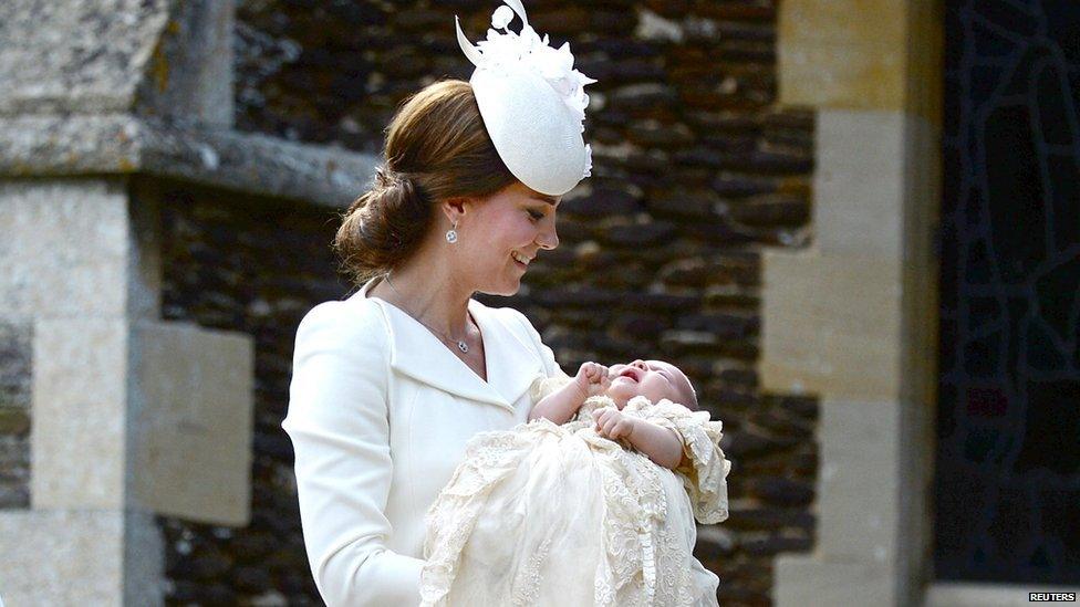 Catherine, the Duchess of Cambridge carries Princess Charlotte