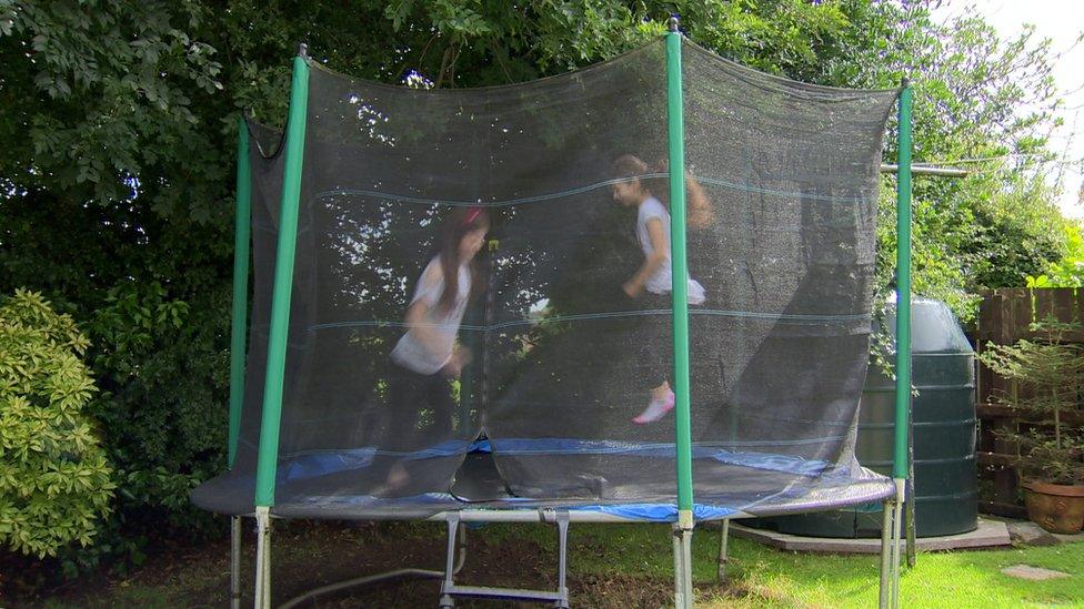 Zona Armstrong playing on a trampoline