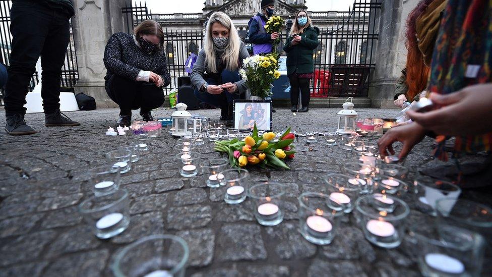 Candles were lit and flowers left beside a picture of Ms Murphy