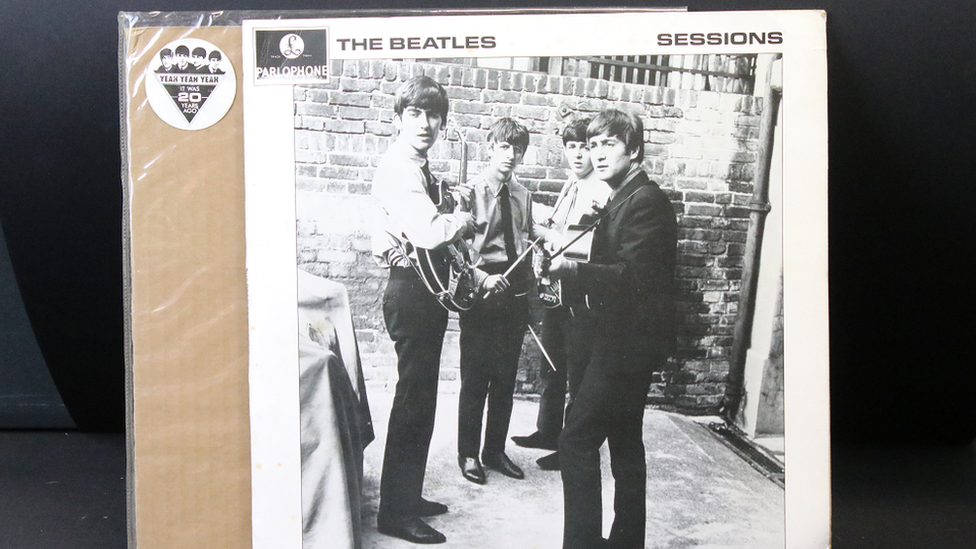 Beatles Sessions front cover - a black and white photograph of the band holding guitars and drum sticks