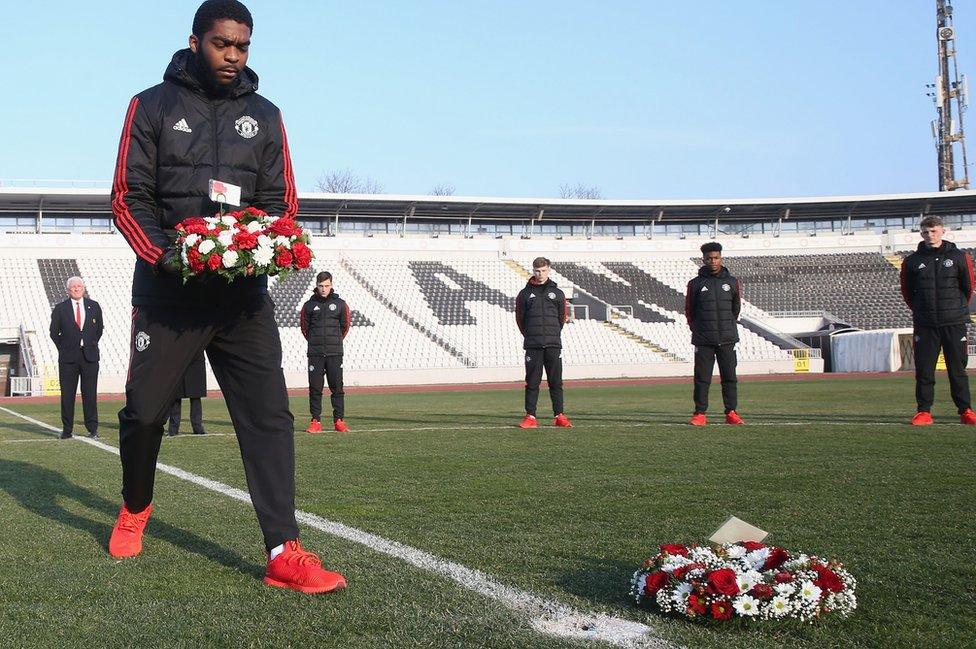 Ro-Shaun Williams of Manchester United U19s lays a wreath at Partizan Stadium