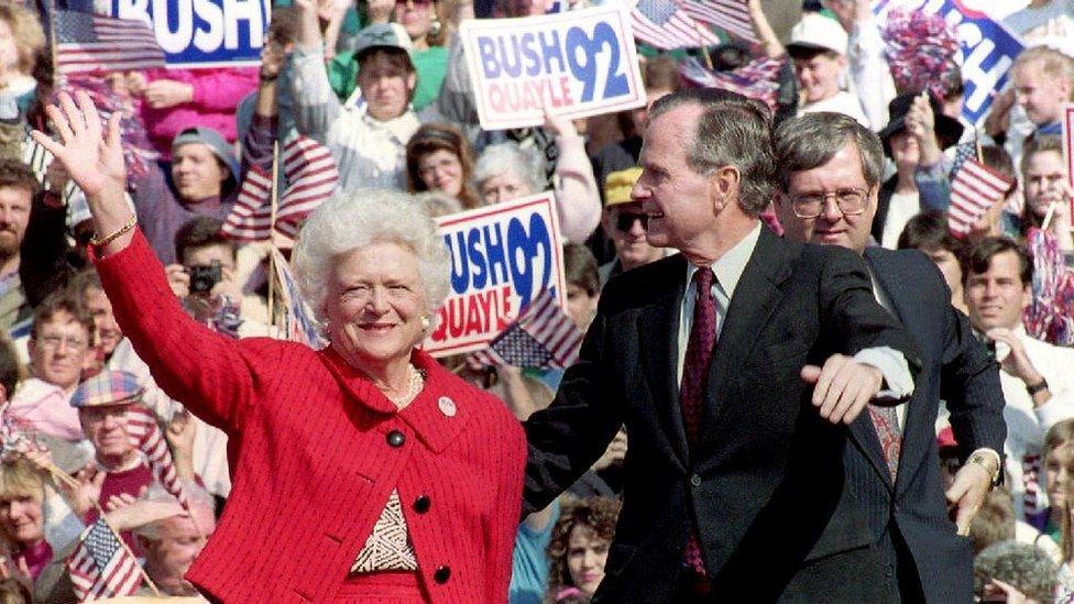 US President George Bush and First Lady Barbara Bush wave to supporters 12 October, 1992 at a campaign rally in Springfield, Pennsylvania.