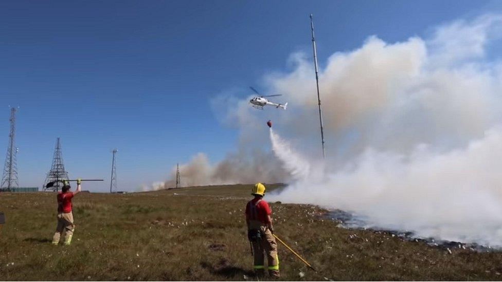 Helicopter drops water