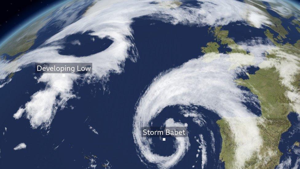 Swirling white cloud near the Canary Islands and another mass of cloud developing in the Atlantic