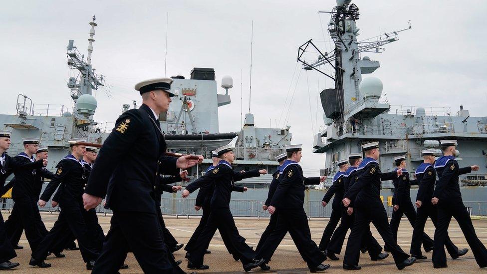 Members of the ship's company march past HMS Montrose following its decommissioning ceremony at His Majesty's Naval Base in Portsmouth, concluding over 30 years of operations and deployments across the globe