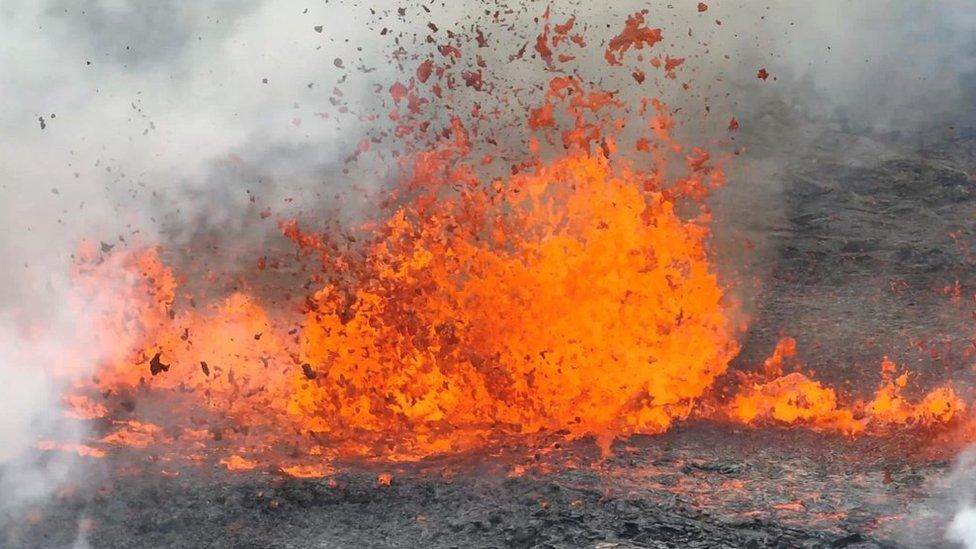 Lava jumping out of volcanic fissure