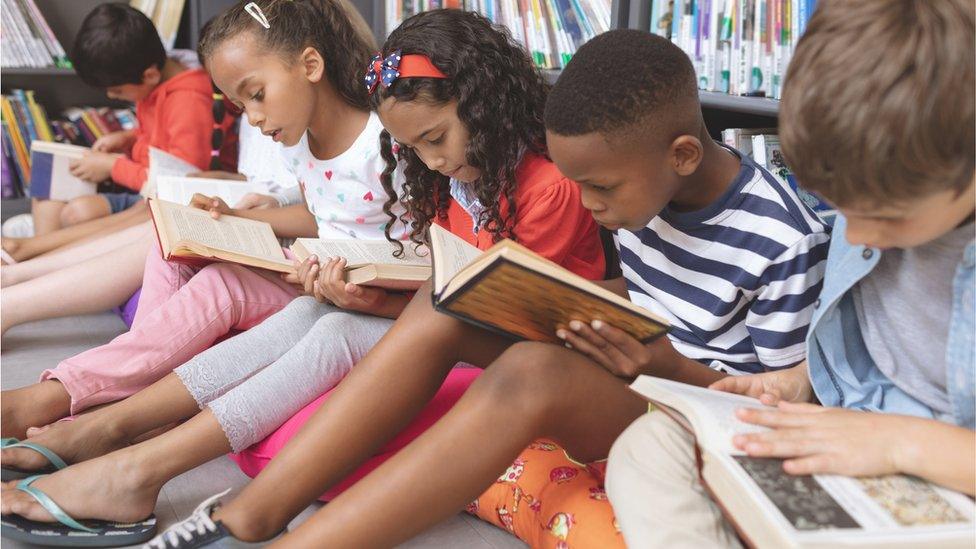 Children-sat-floor-reading.