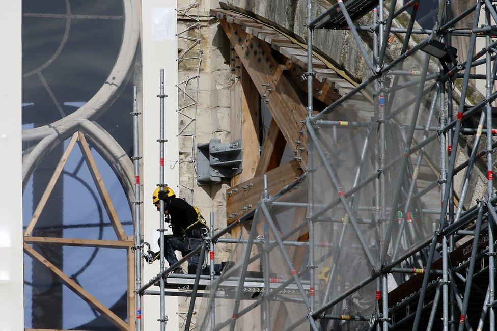 Workers are seen restoring the Notre-Dame cathedral