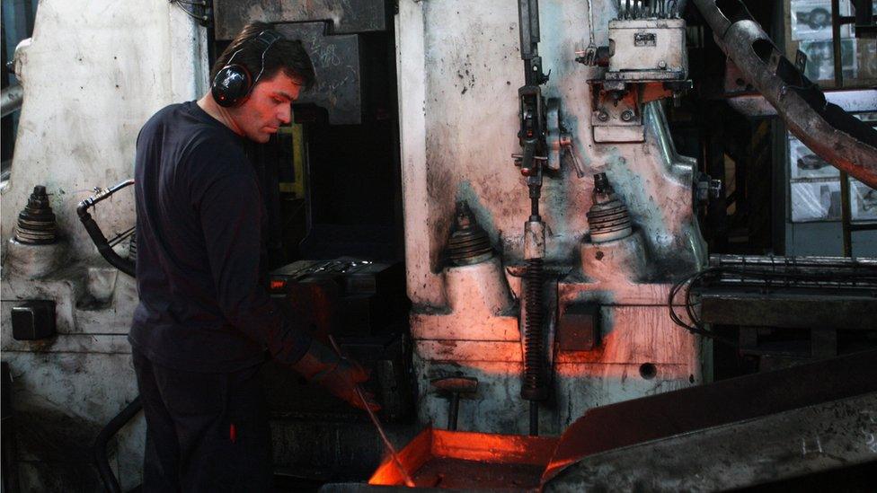 Employee working in a car spare parts factory in Gebze, Turkey (November 2008)