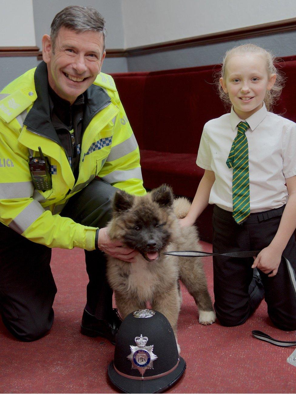 Sgt Stephen Knight with puppy Rosco and Zoe Picken